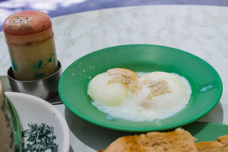 Half-boiled eggs, Traditional Singapore Breakfast called Kaya Toast, Original bread toast with kaya a local jam made from eggs, sugar and coconut milkの写真素材