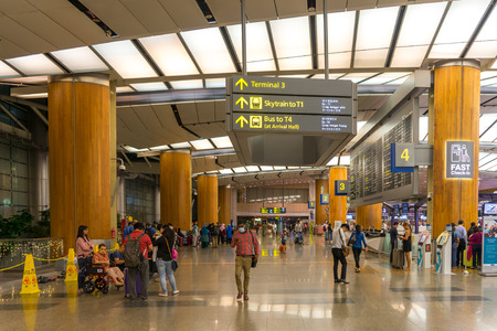 Singapore - December 22, 2017: Visitors walk around Departure Hall in Changi Airport. It has 3 passenger terminals, one of the largest transportation hubs in Asia and serves more than 100 airlines.のeditorial素材