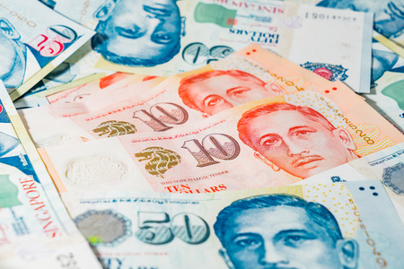 Singapore Dollar, Banknote Singapore on White background, The Singapore dollar is the official...
