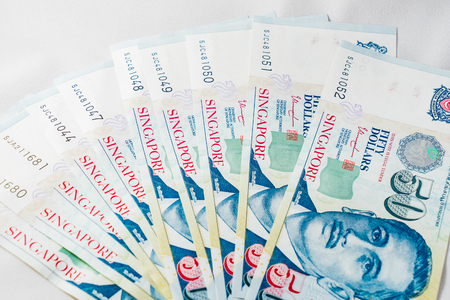 Singapore Dollar, Banknote Singapore on White background, The Singapore dollar is the official...