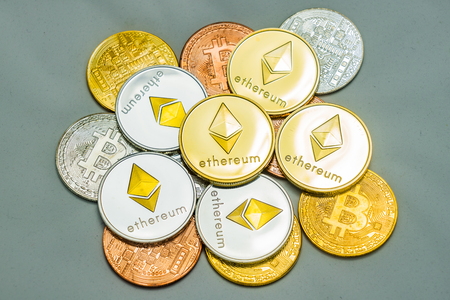 Bitcoin and Ethereum coins Cryptocurrency coins on White background, Golden Silver and Bronze coins...