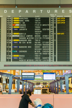 Singapore - January 6, 2018: Departure Board in Changi Airport. Departure Hall Singapore. It has 3 passenger terminals, and it is one of the largest transportation hubs in Asiaのeditorial素材
