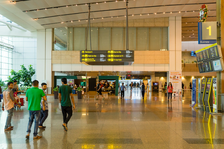 Singapore - January 6, 2018: Visitors walk around Departure Hall in Changi Airport. It has 3 passenger terminals, one of the largest transportation hubs in Asia and serves more than 100 airlinesのeditorial素材