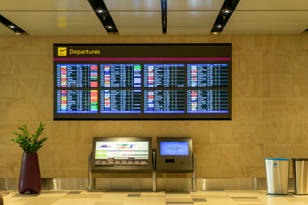 Singapore - July 14, 2018: Departure Board in Changi Airport. Departure Hall Singapore. It has 4 passenger terminals, and it is one of the largest transportation hubs in Asiaのeditorial素材