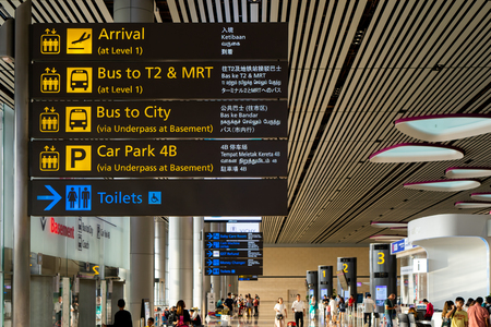 Singapore - Julyy 14, 2018: Visitors walk around Departure Hall in Changi Airport. It has 4 passenger terminals, one of the largest transportation hubs in Asia and serves more than 100 airlinesのeditorial素材