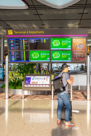 Singapore - July 14, 2018: Departure Board in Changi Airport. Departure Hall Singapore. It has 4 passenger terminals, and it is one of the largest transportation hubs in Asiaのeditorial素材