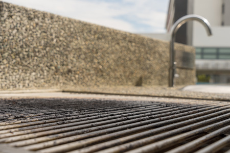 BBQ Pit on the empty steel barbecue grill Background, Summer Outdoor Barbecue Party Conceptの写真素材