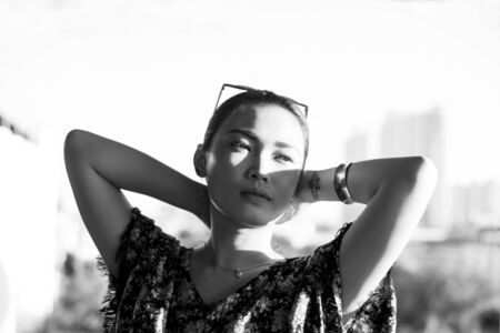 Young woman outdoors portrait. Black and white colors.の写真素材