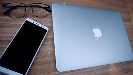 Jakarta, Indonesia - February 16, 2021: Apple MacBook Air Silver 2017 use for work from home...