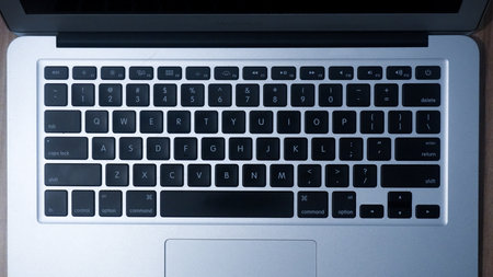 Jakarta, Indonesia - February 16, 2021: Apple MacBook Air Silver 2017 use for work from home captured in close upのeditorial素材