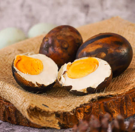 Popular traditional dish in central java made by duck egg; called telur bebek bakar, One of new varian duck eggs with burnprocess methodの写真素材