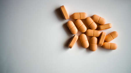 Various capsules and pills with dietary supplements or medicines isolated in whiteの写真素材