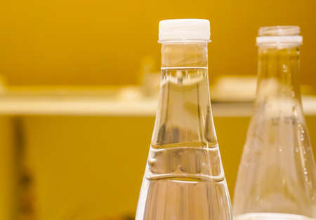 conference hall/ Empty small conference hall with a large wooden table. Notebooks and mineral water on the table. Retro styleの写真素材