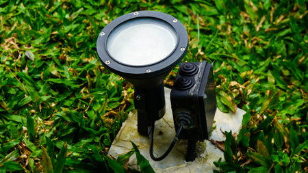 Close-up of a flashlight on the grass. Selective focus.の写真素材