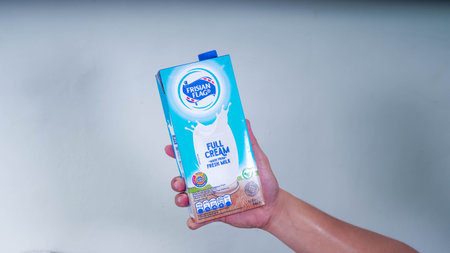 Jakarta Indonesia, 10th May 2022: delicious full cream milk produced by Frisian Flag brand in selective focusのeditorial素材