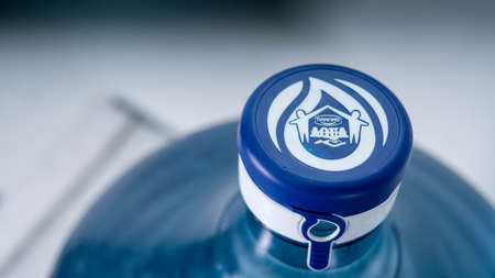 Jakarta, Indonesia, 2022-05-14, mindsection of gallons of aqua mineral water brand in selective...
