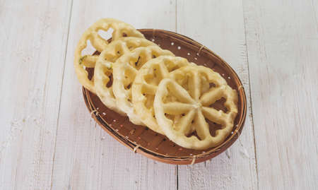 Kembang Goyang or shaking flower, Indonesian typical homemade crispy fried snack in flowers shape and typical of Betawi Snack and very popular for the Eid Mubarakの写真素材