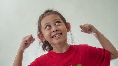 Little Asian Girl looks get idea in selective focus