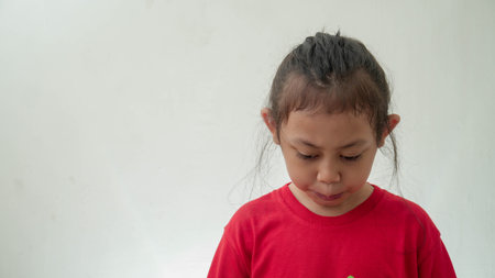 little Asian girl crying in selective focusの写真素材
