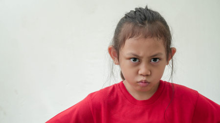 Little Asian girl Angry and displeased in selective focusの写真素材