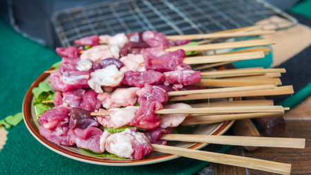 Korean style pork skewer at street food market in South Koreaの写真素材