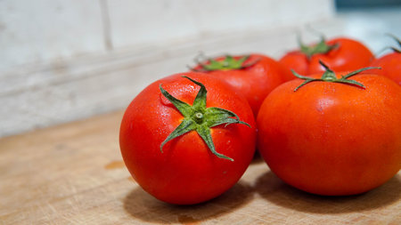 Tomatoes on a cutting board. Selective focus, shallow depth of field.の写真素材