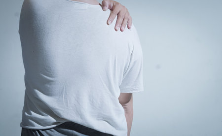 Man suffering from back pain isolated on white background with clipping path.の写真素材