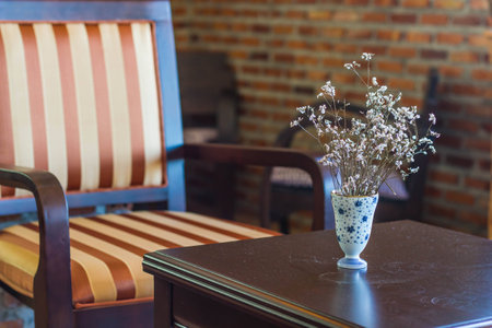 Dry flower in vase on wood tableの写真素材