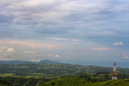 high voltage pole Located on the mountain and blue skyの写真素材