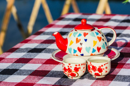 cute tea pot on tableの写真素材