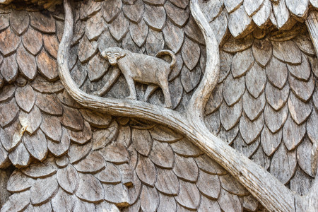 wood carve about monkey in forest at public templeの写真素材