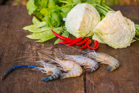 Fresh shrimps on wood tableの写真素材