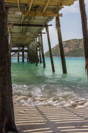 under wood bridge at the sea.の写真素材