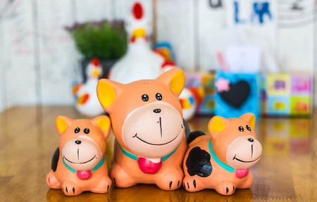 Dog doll on wood table.の写真素材