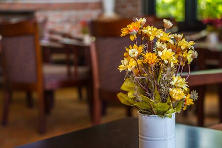 Fabric flower on wood tableの写真素材