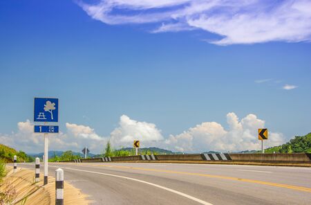 A sign showing a roadside accommodation on roadの写真素材
