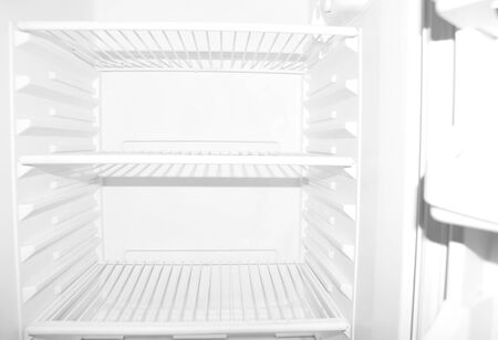 Empty white student refrigerator without any food insideの写真素材