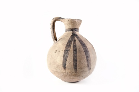 Clay old Middle Eastern jug on the white backgroundの写真素材