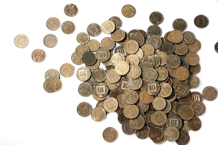 A lot of scattered coins on the white backgroundの写真素材