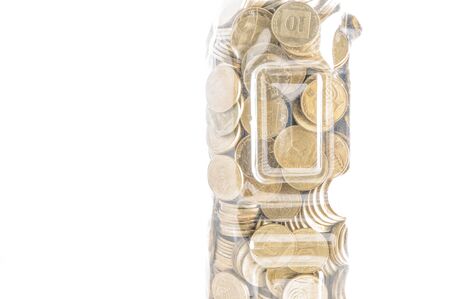 Fragment of plastic bottle with coins on white backgroundの写真素材