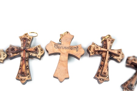 Row of wooden crosses isolated on white backgroundの写真素材