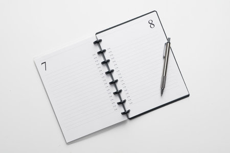 Empty book and pen top view.の写真素材