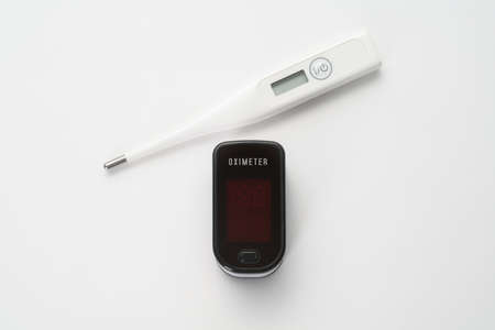 Top view of portable digital fingertip oximeter and thermometer
