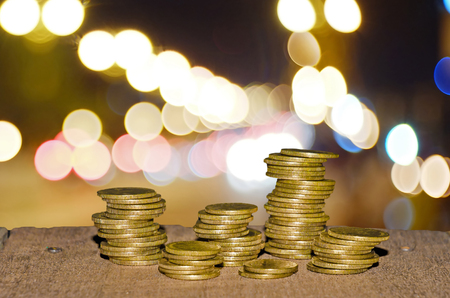 Coin stack on the wooden floorの写真素材