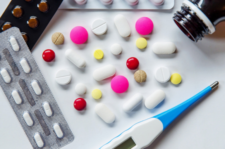 Top view of the pills on the white background, Pack of tablet drug and capsule pills on the floor, Pile of the drug and pills on the white background.の写真素材