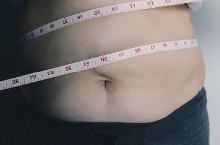 Close-up of human body and fat body, Fat body part of paunch or belly, Overweight of people or...
