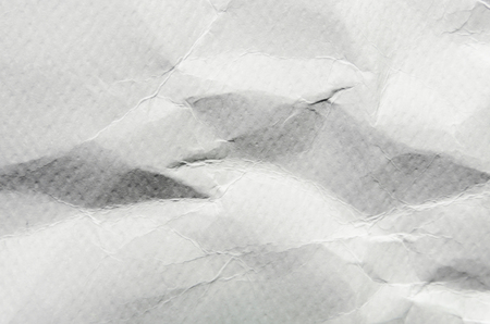 White background and wallpaper by crumpled paper, White crumpled paper texture with empty and free space for text, Background by scruffy paper texture and detail.の写真素材