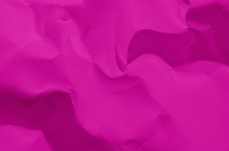 Pink background and wallpaper by crumpled paper, Pink crumpled paper texture with empty and free space for text, Background by scruffy paper texture and detail.の写真素材