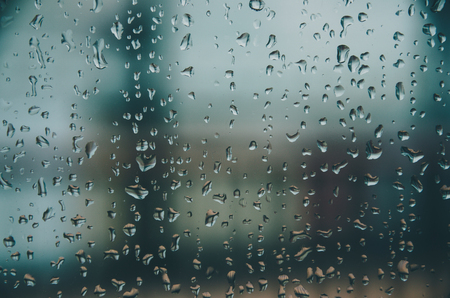 Wallpaper of rain drops or water drops on the glass, Vintage background by rainy drop on window,...