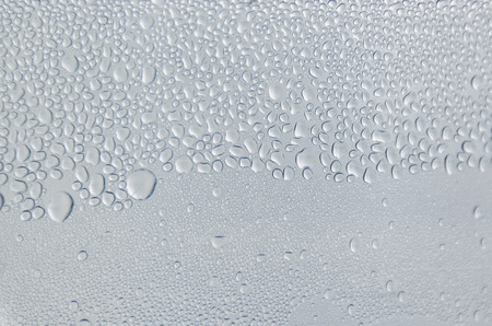 Wallpaper of rain drops or water drops on the glass, Vintage background by rainy drop on window,...